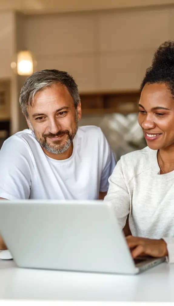 Man and women looking at laptop