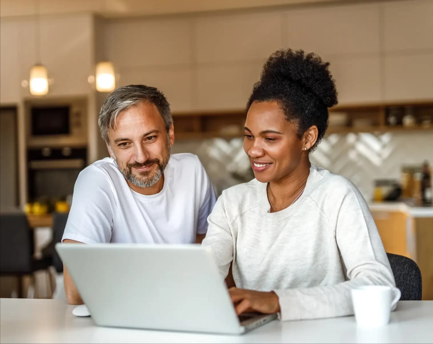 Man and women looking at laptop