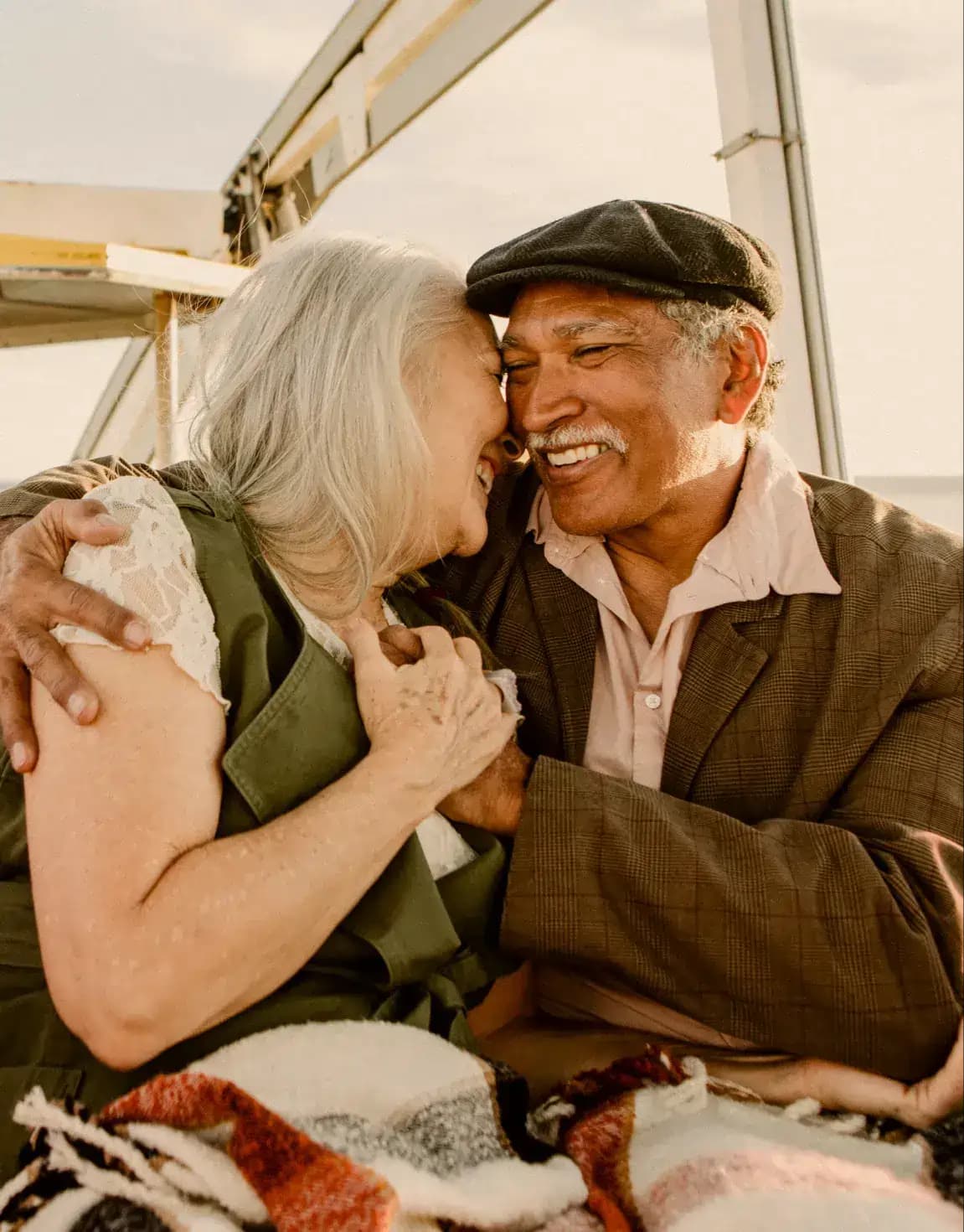 Man and women holding hands and smiling